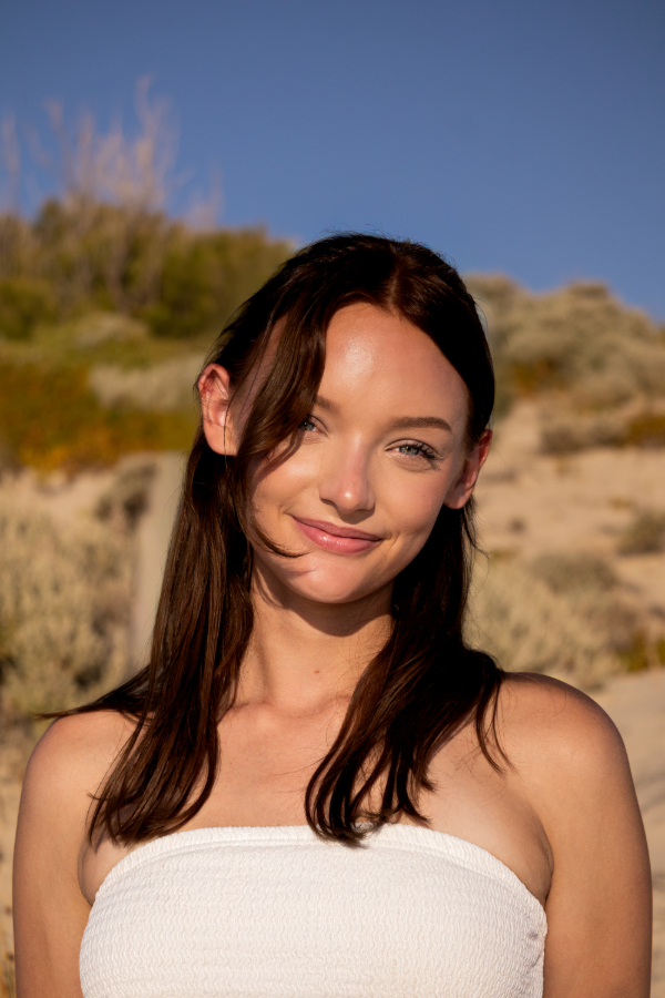 Natural sunlight outdoor portrait of a woman at the beach during a lifestyle photography shoot in Western Australia.