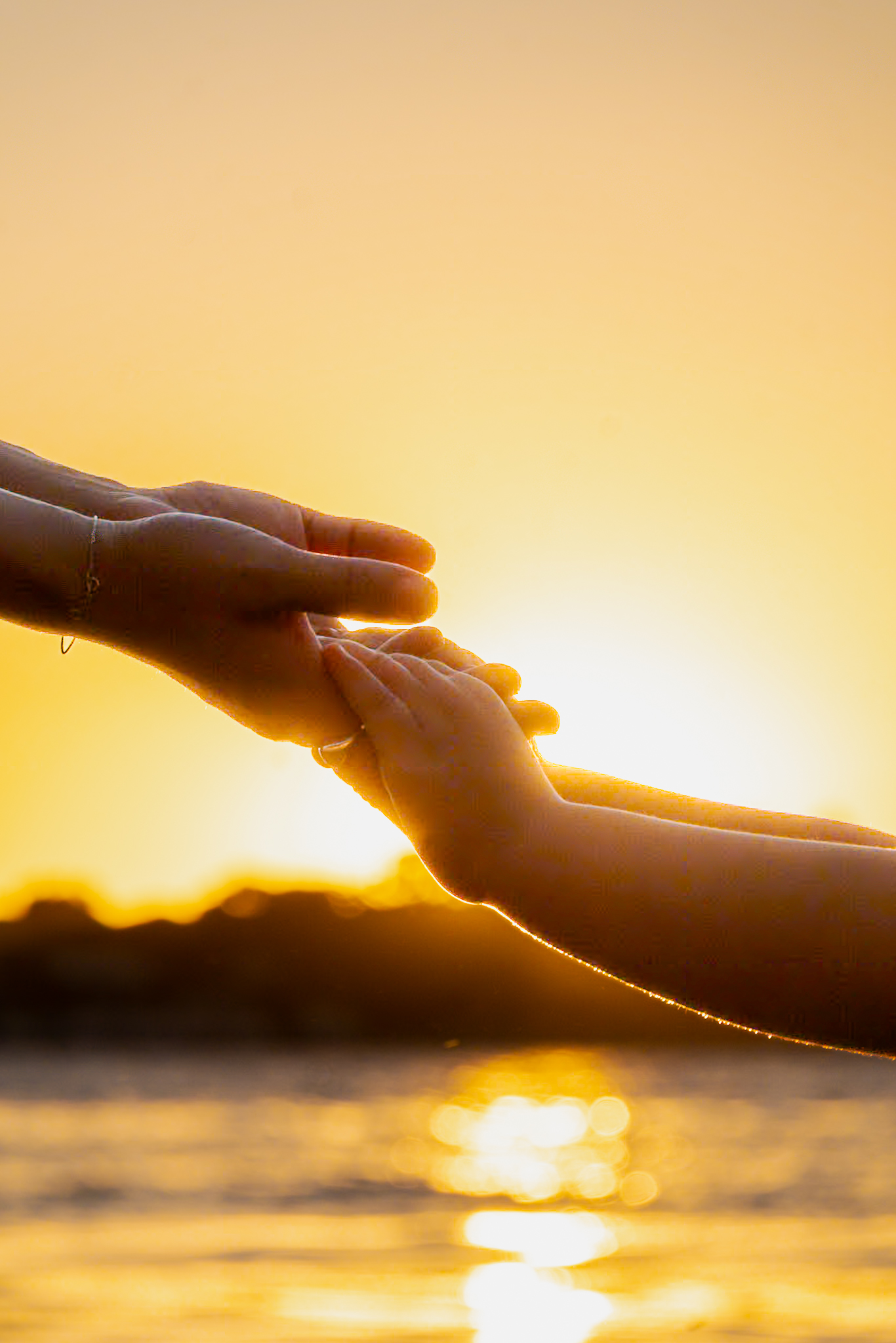 Artistic detail shot capturing the connection between mother and child during a Perth family session